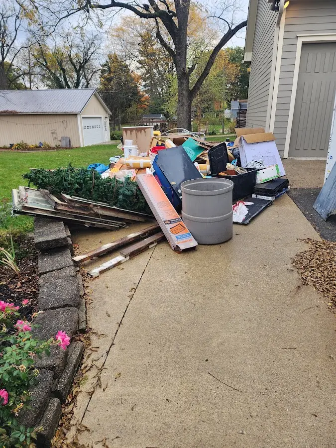 Dumpster being loaded with debris for 3 Yard Dumpster Rental in Watseka